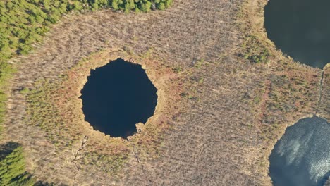 AERIAL:-Strange-Looking-Lakes-That-Resembles-Alien-Face-with-Reflections-on-Water-Surface