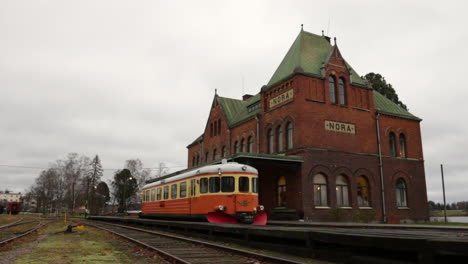 Wide-shot-of-an-old-trainstation-in-Sweden-on-a-cloudy-day
