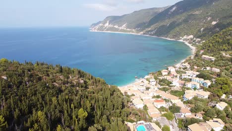 Beautiful-Coastal-Village-Agios-Nikitas-at-Lefkada-Island,-Greece---Aerial