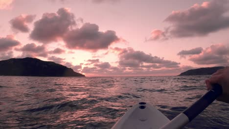 POV-Of-Person-Paddling-Boat,-Enjoying-Beautiful-Sunset-Over-Idyllic-Ocean