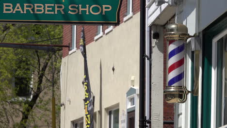 Barber-shop-sign-and-revolving-barber-pole
