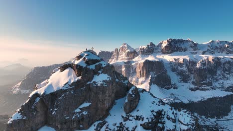 Mountaineer-standing-on-a-summit-in-the-Dolomites---Südtirol