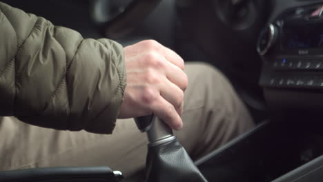 Shot-of-the-driver's-hand-shifting-gears-while-driving