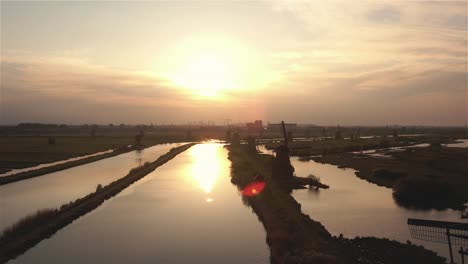 drone-flight-flying-past-the-windmills-of-Kinderdijk-at-sunset-in-4k