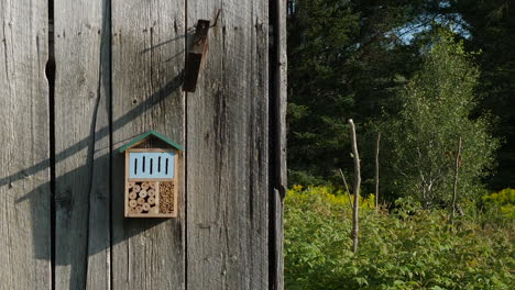 Wooden-insect-habitat-on-old-barn