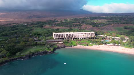 Aerial-time-lapse-view-reveal-Mauna-Kea-crescent-tropical-beach-and-luxury-Hawaiian-hotel-resort