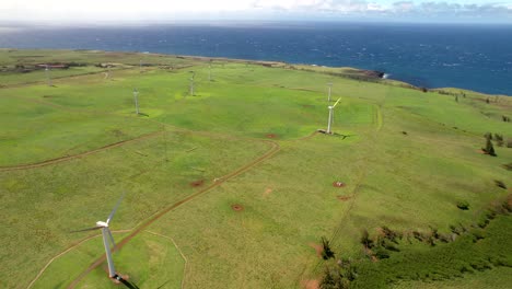 Hawi-Wind-Farm-on-Upolu-Point-of-Hawaii's-Big-Island-with-an-aerial-view-of-the-ocean-and-wind-turbines-generating-clean,-alternative-energy