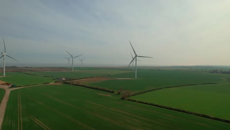 Wind-Turbines-Generating-Electricity,-Lissett-Airfield-Wind-Farm,-Yorkshire,-UK---aerial-drone-shot