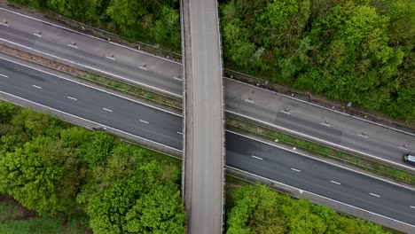 Birds-eye-view-of-a-bridge-crossing-the-A2-dual-carriage-way-Canterbury-with-cars-and-lorries-passing-underneath