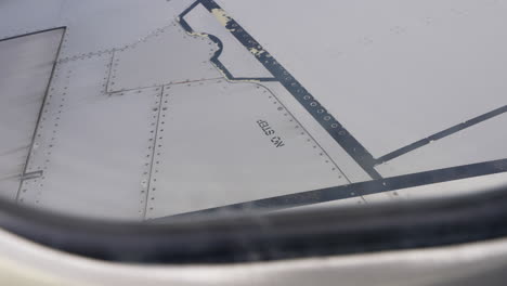 No-Step-Warning-Sign-On-White-Airplane-Wing-Seen-From-Passenger-Window