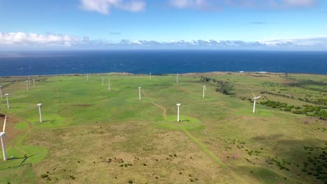 Aerial-view-of-wind-farm-with-spinning-turbines-in-Hawaii-on-sunny-day