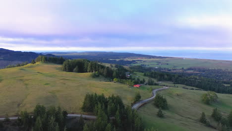 Green-hills-of-Langlois-Oregon-at-sunrise,-drone-view