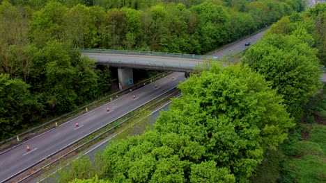 Vibrant-drone-shot-of-green-trees-running-along-side-the-A2-dual-carriage-way-in-Canterbury