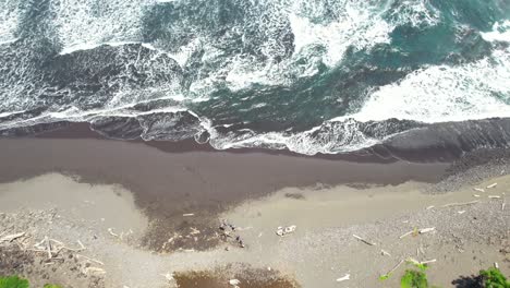 Aerial-Birdseye-View-Of-Black-Sand-Beach-With-Ocean-Waves-In-Punaluu-On-Hawaii-Big-Island