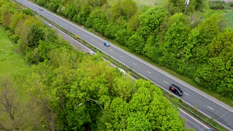 Static-aerial-drone-shot-of-vehicles-traveling-along-the-A2-towards-Canterbury-and-Dover