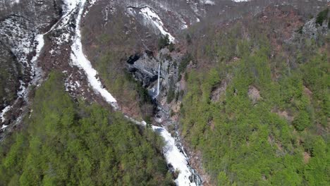 Waterfall-of-Rragam-in-Albanian-Valbona-valley-with-ice-water-melting-from-snow-in-mountains