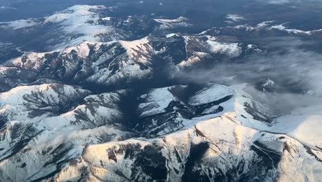 Aerial-view-from-a-jet-cockpit-overflying-snowed-mountains-in-north-Spain