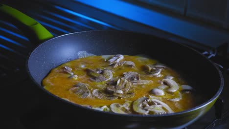 Cooking-Eggs-With-Sliced-Mushroom-In-A-Skillet