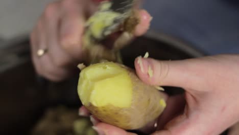 Woman-Peeling-Boiled-Potatoes.-Close-Up-Of-Hands