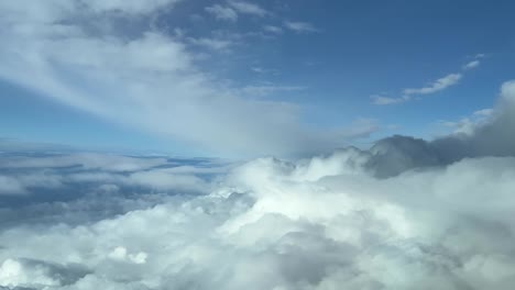 Aerial-view-from-a-jet-cockpit-of-a-nice-cloudy-sky-and-blue-sky
