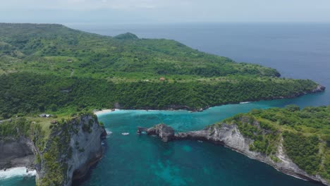 Nusa-Penida-coastline-with-Jogglo-Viewpoint,-Atuh-Beach-and-Nusa-Batupadasan-island,-tropical-Indonesia,-aerial