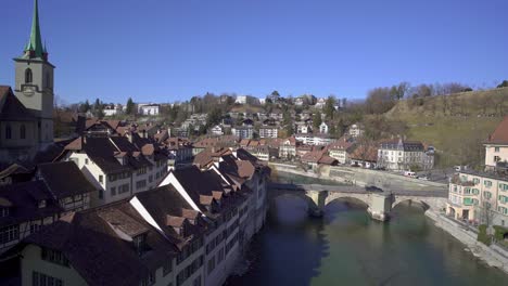 Slow-panning-shot-revealing-the-old-city-of-Bern-from-a-bridge-across-the-River-Aare