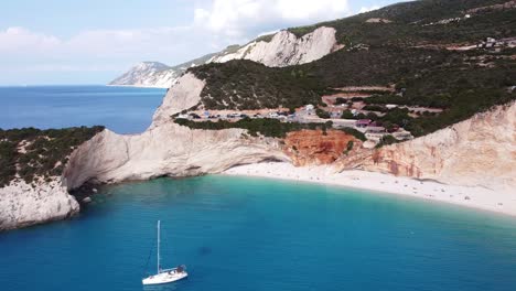 Porto-Katsiki-Beach-and-Luxury-Boats-at-Lefkada-Island,-Greece---Aerial-Reversing