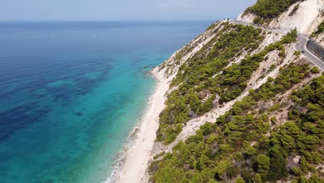 Scenic-Coastal-Road-and-Turquiose-Ionian-Sea-at-Lefkada-Island,-Greece---Aerial