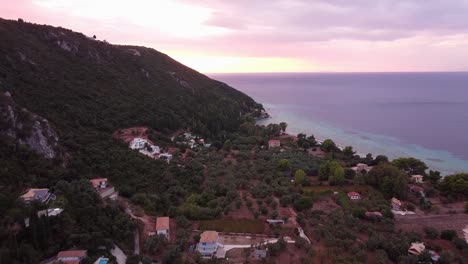 Colorful-Pink,-Yellow,-Blue-Sunset-at-Lefkada-Island,-Greece---Aerial