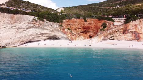 People-Relax-and-Swim-at-Porto-Katsiki-Beach,-Lefkada-Island,-Greece---Aerial