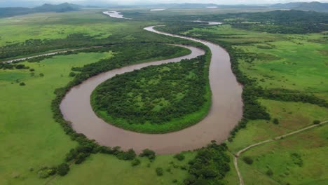 aerial-drone-shot-view-river-meandering-like-a-snake,-tropical-rain-forest,-natural-wilderness