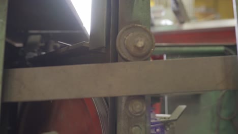 Closeup-Of-A-Saw-Blade-Rotating-On-A-Industrial-Bandsaw