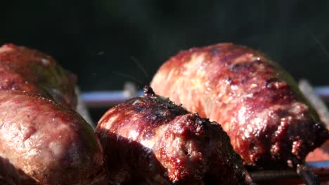 Sausages-sizzling-on-barbecue,-close-up