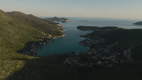 Aerial-Flyover-Of-Dalmatian-Coastal-Town-And-Bay-In-Croatia-At-Sunset,-5K-Drone