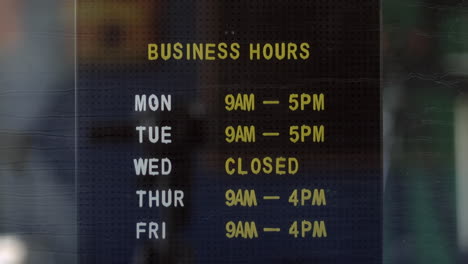 Business-opening-hours-in-an-office-shop-window