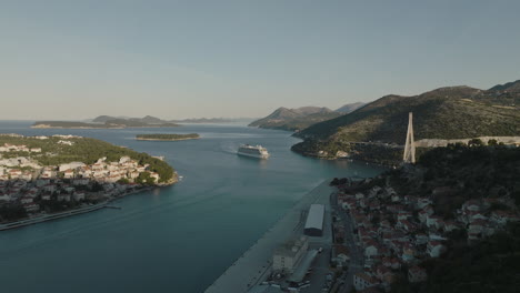 Scenic-European-Seaside-Town-Dubrovnik-Croatia-In-Afternoon-Sun-With-Cruise-Ship-In-Aerial-5K-Drone-View