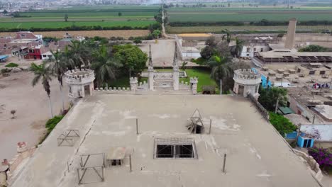Drone-video-flying-forward-on-top-of-an-abandoned-castle-in-Peru-called-"Castillo-Unanue"-Green-fields-can-be-seen-in-the-horizon