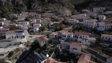 Drone-video-of-empty-descriptive-plane-from-a-bird's-eye-view-over-the-village-Nje-Maj,-Spile,-Sen,-on-Albanian-coast