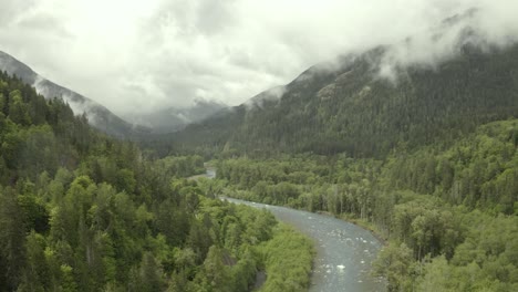 Drone-footage-of-misty-and-foggy-Pacific-Northwest-mountains-with-river