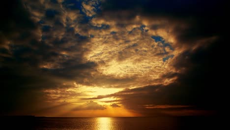 Dark-warm-color-clouds-Ocean-view-waterflow-at-night-in-Malmo-Sweden-summertime-sunset