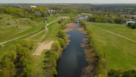 Idyllic-Pond-With-Grass-Covered-Landscape-In-Myslecinek-City-Park-In-Bydgoszcz,-Poland
