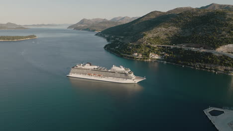 Scenic-Flyover-Over-Cruise-Ship-In-Dubrovnik-Croatia-Mountainside-Harbor-In-Aerial-5K-Drone