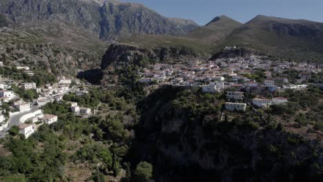 drone-video-of-empty-descriptive-plane-towards-the-village-of-Nje-Maj,-Spile,-Sen-in-Himare,-on-the-Albanian-coast,-laSh8