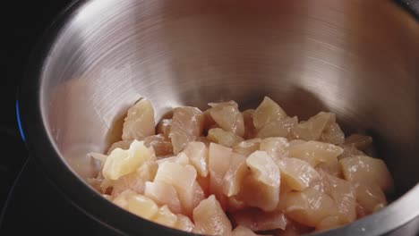 Putting-Sliced-Chicken-Breast-Into-A-Bowl
