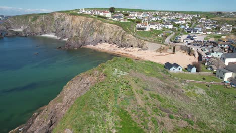 Hope-cove-seaside-village-Devon-UK-drone-reveal-over-cliffs-aerial-view