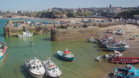 Fishing-Boats-At-Newquay-Harbour-During-Lowtide-In-Cornwall,-United-Kingdom