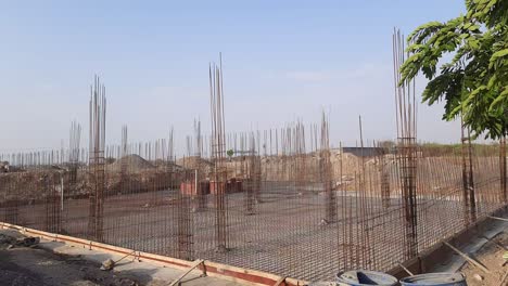 Construction-works-fabricating-steel-reinforcement-bars-at-the-construction-site