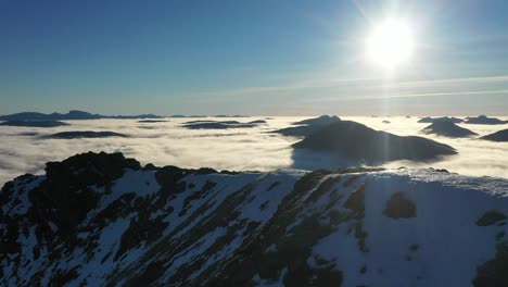 Mountain-ridge-with-cloud-inversion-on-Gleouraich,-munro-bagging-in-Scotland,-Highlands