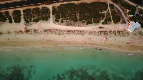 high-drone-view-of-a-sandy-beach-in-puglia-italy-overlooking-the-mediterranean