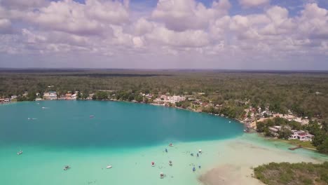 Upward-panning-drone-shot-of-the-stunning-view-of-the-lagoon-of-seven-colours-in-Bacalar,-Mexico